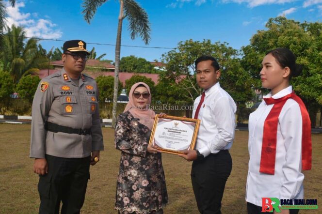 
					Sinergi Pemerintah dan Polres Kampar: Bupati Beri Penghargaan Atlet Taekwondo Berprestasi