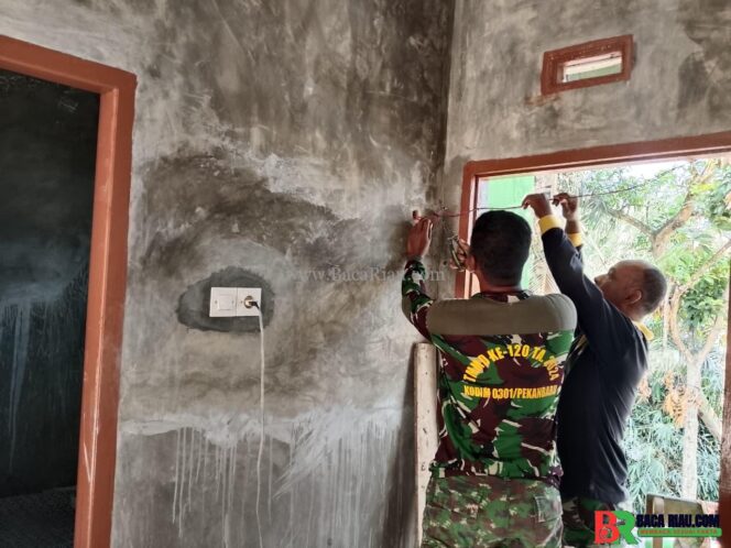
					Satgas TMMD ke-127 Kodim 0301/Pekanbaru Hadirkan Cahaya Harapan di Rumah Almarhum Yudarfis